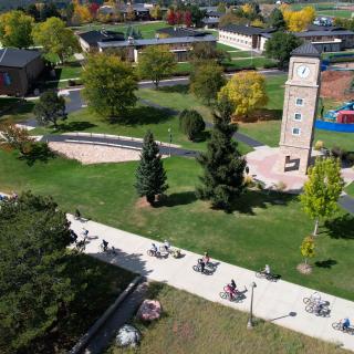 Group Bike Ride During Spoketober In Fall Via Drone