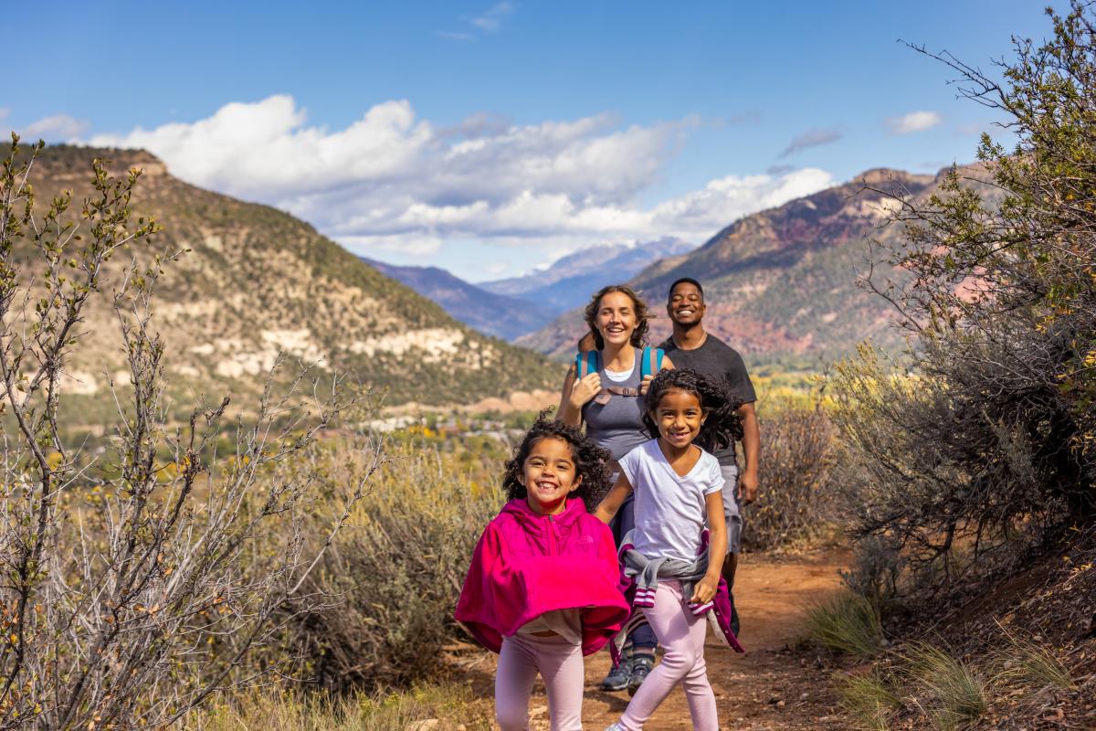 Family Hiking on the Rim Trail During Fall