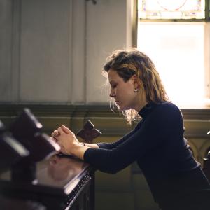 Woman Praying in Church